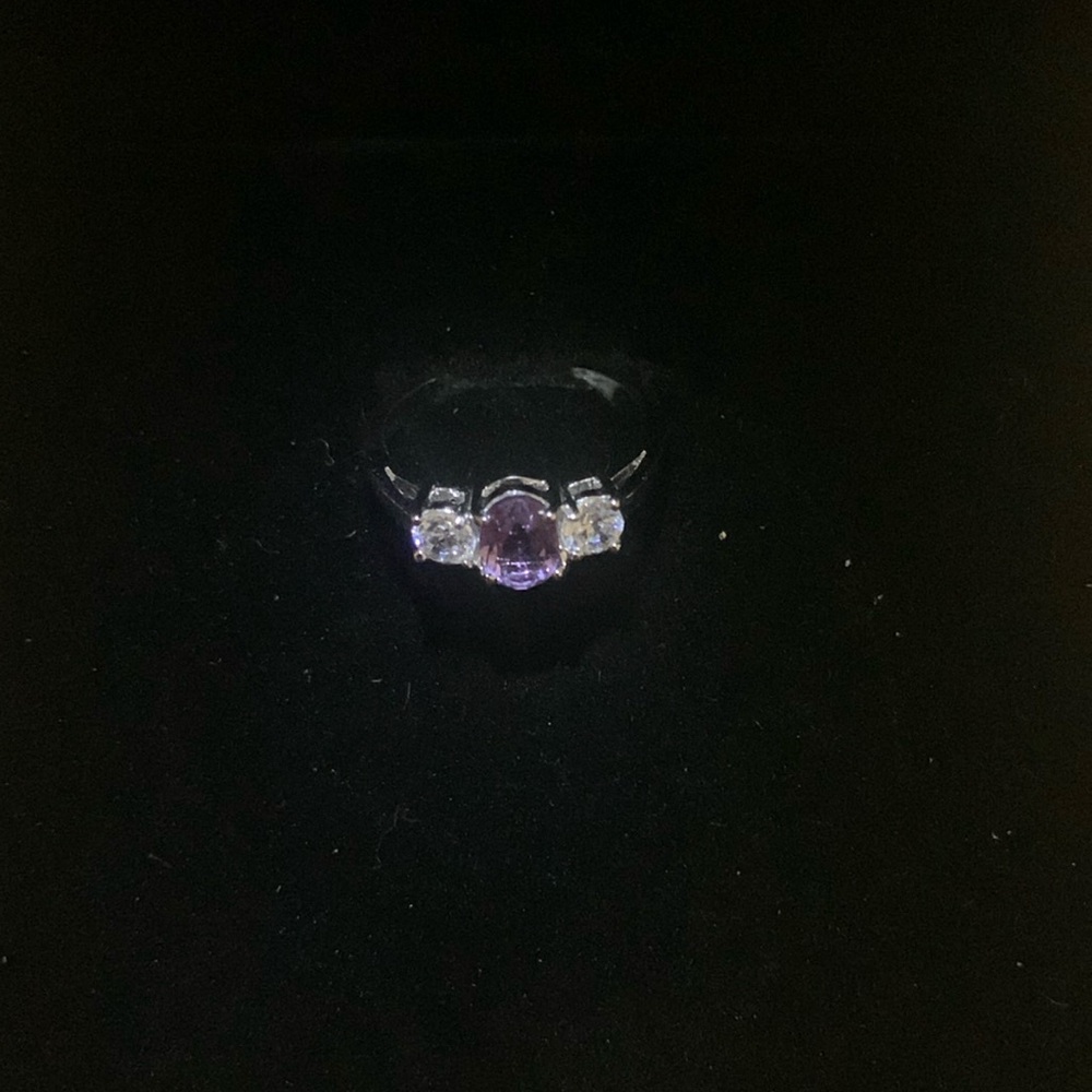 Silver toned ring with clear and purple rhinestones